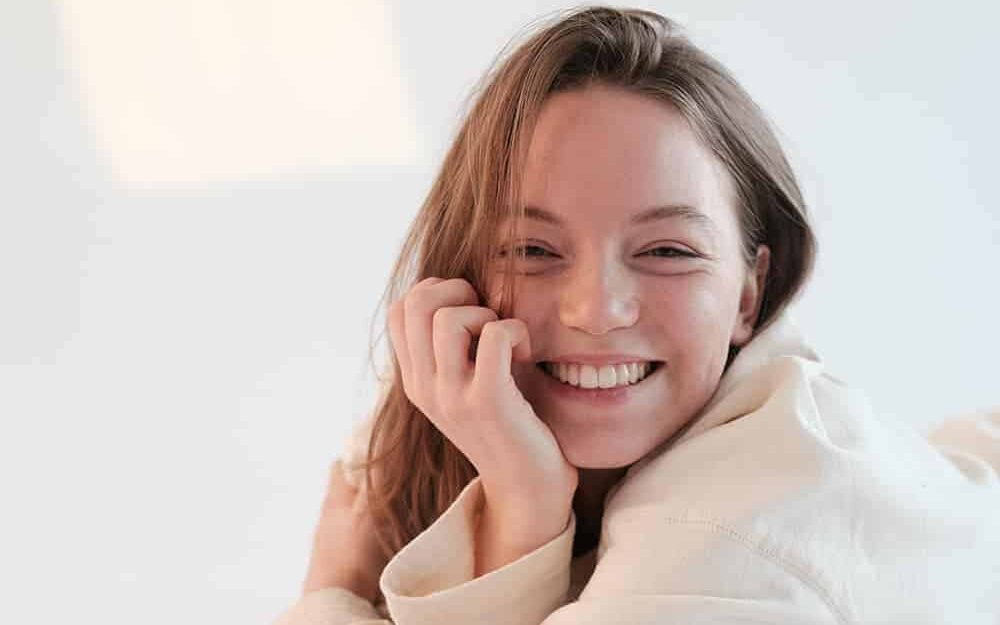Girl in bathrobe smiling